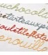 broderie sur serviette et drap de bain grise